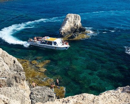 _DSC0010 Boat passing by in the clear waters at the sea caves.