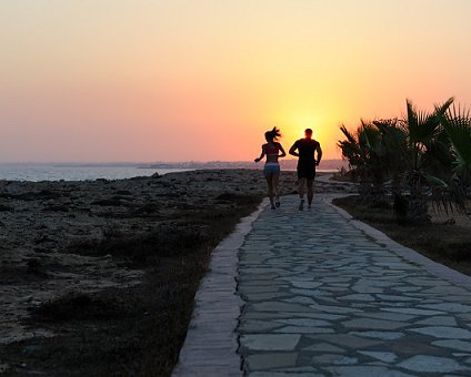 _DSC0077 Couple jogging towards the sunset in Protaras.