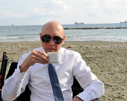 _DSC0027 Markos having coffee by the sea.