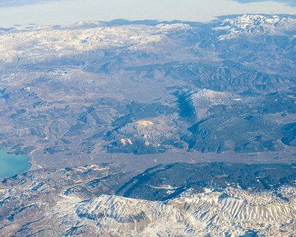 _DSC0008 Flying to Cyprus, above the mountain peaks with snow in Turkey.