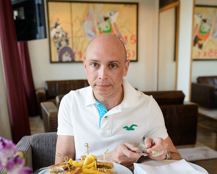 _DSC0126 Markos having a snack in the lounge at the hotel.