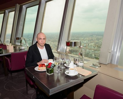 _DSC0091 Markos having lunch in the rotating restaurant Sphere in the TV-tower at Alexanderplatz. At a hight of 207 meters.