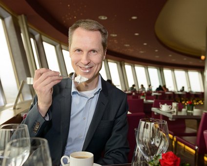 _DSC0102 Arto having dessert in the rotating restaurant Sphere in the TV-tower at Alexanderplatz. At a hight of 207 meters.
