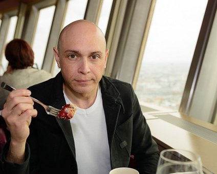 _DSC0103 Markos having dessert in the rotating restaurant Sphere in the TV-tower at Alexanderplatz. At a hight of 207 meters.