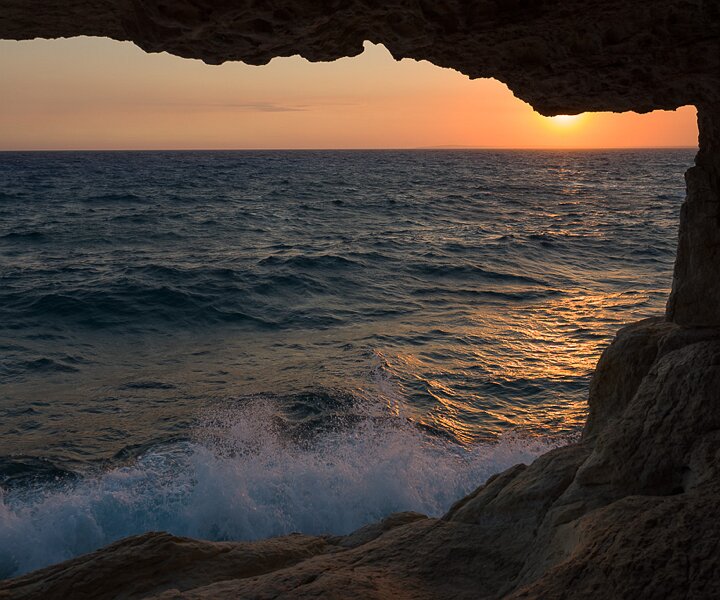 _DSC0079 Sunset from the sea caves at Cavo Greco.