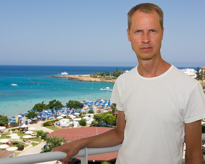 _DSC0103 Arto on the balcony of the room at Capo Bay hotel.