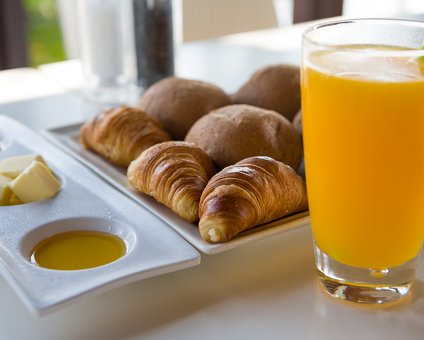 _DSC0168 Breakfast at Capo Bay hotel with fresh orange juice and croissants.