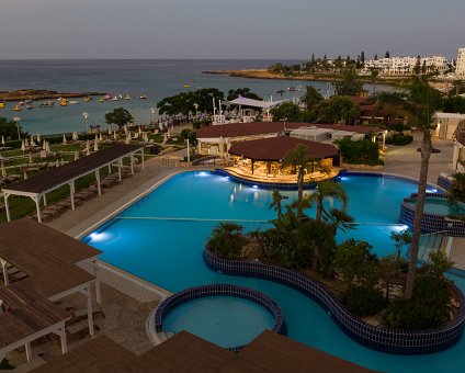 _DSC0243 Evening view of the pool area and Fig Tree Bay from the balcony of the hotel room at Capo Bay hotel.