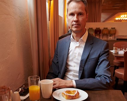 _DSC0999 Arto having breakfast with Danish pastries and croissants at the hotel in Copenhagen.