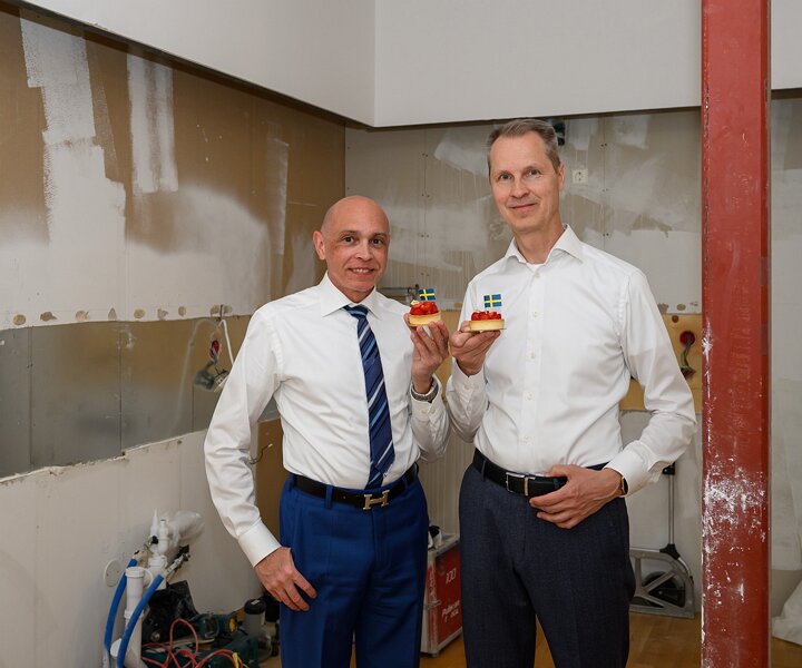 _DSC0043 Markos and Arto celebrating the national day of Sweden with a strawberry tart in the kitchen.